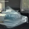 A bedroom scene with a bed, nightstand, and a fan blowing air. Produktbild-Vorschau