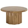 A round wooden coffee table with a fluted drum base, shown against a white background. Produktbild-Vorschau