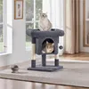 Two cats on a cat tree in a room with windows and curtains.