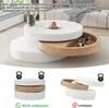 A multi-level coffee table with a rotating top, shown in a living room setting and in diagrams demonstrating stability. Produktbild-Vorschau