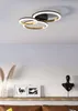 A modern ceiling light fixture with three interlocking rings, mounted on a white ceiling. Produktbild-Vorschau