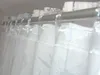 A close-up view of white curtains hanging from a rod. Produktbild-Vorschau