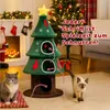 A Christmas-themed cat tree with two cats in a festive living room setting. Anteprima dell’immagine prodotto