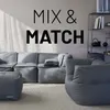 A modular sofa set with beanbag-like seating is arranged in a living room setting, with text on the wall above. Náhled obrázku produktu