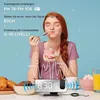 A young woman eating yogurt in front of a digital alarm clock with radio waves emanating from it. Náhled obrázku produktu