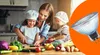 A mother and two children are preparing food in a kitchen, with a light bulb superimposed on the right side of the image. Produktbild-Vorschau