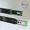 A close-up product shot of two black heavy-duty drawer slides with green accents, displayed diagonally against a light gray and white gradient background. The top slide is slightly retracted, showing the inner mechanism, while the bottom slide is fully ext Produktbild-Vorschau