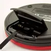 Close-up view of the open battery compartment of a portable CD player. Produktbild-Vorschau