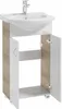 A white ceramic sink with a chrome faucet is mounted on a white and wood-grain cabinet with two doors. Voir les images du produit