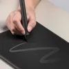 A hand is using a stylus on a drawing tablet, creating a curved line. Podgląd zdjęcia produktu