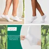 A collage featuring close-ups of white socks on models' feet, accompanied by text and imagery of bamboo stalks. Produktbild-Vorschau