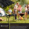 People enjoying a barbecue and camping in a grassy area with a tent. Produktbild-Vorschau