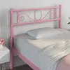 A pink metal bed frame with a white pillow and bedding. Produktbild-Vorschau