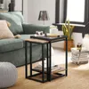 Zwei stapelbare SoBuy Couchtische FBT99-F in Schwarz/Braun vor grüner Couch Podgląd zdjęcia produktu
