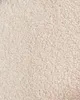 A close-up, textured view of beige bouclé fabric. Náhľad obrázku produktu