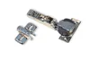 A product shot of two cabinet hinges on a white background. Produktbild-Vorschau