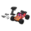 A remote-controlled off-road car with its accessories, including a remote control and battery pack, displayed on a white background. Anteprima dell’immagine prodotto