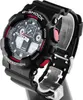A black G-Shock watch with red accents is displayed on a stand against a white background. Náhľad obrázku produktu