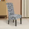 A chair with a patterned slipcover is shown in a room setting. Produktbild-Vorschau