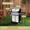 A gas grill is shown in a backyard setting with a wooden fence and grass. Produktbild-Vorschau