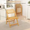A set of rattan folding chairs displayed in a kitchen/dining area setting. Podgląd zdjęcia produktu