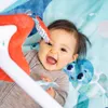 A baby is playing on a colorful playmat with toys. Produktbild-Vorschau
