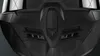 A close-up, detailed view of the front of a black helmet, focusing on the chin guard and ventilation. Voir les images du produit