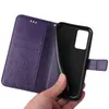 A hand is holding a purple flip phone case open, revealing the inside of the case and the phone holder. Produktbild-Vorschau