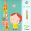 A child's toy box illustration featuring stacking cubes with animal and nature designs, a cartoon girl, and a bird. Anteprima dell’immagine prodotto