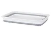 A rectangular, collapsible silicone bowl with a white interior and gray rim and base, shown from a side-angle on a white background. Náhled obrázku produktu