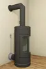 A modern black wood-burning stove with a flue pipe attached to the wall. Produktbild-Vorschau
