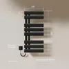 A black electric towel warmer is mounted on a light-colored wall, with dimensions and power specifications indicated by text overlays. Anteprima dell’immagine prodotto