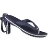 A pair of navy blue Crocs flip-flops with white trim, shown from a side angle. Produktbild-Vorschau