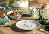 A table setting for a child's birthday party with a dinosaur theme. Produktbild-Vorschau