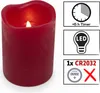 A red LED candle with informational graphics on the right side. Produktbild-Vorschau