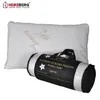 A pillow and its packaging are displayed against a white background. Produktbild-Vorschau