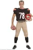 A man dressed in an American football costume, holding a football and helmet. Anteprima dell’immagine prodotto
