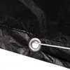 A close-up of a black tarp with a metal grommet and rope. Náhľad obrázku produktu
