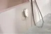Water is flowing from a showerhead into a bathtub. Anteprima dell’immagine prodotto