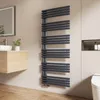 A modern bathroom with a vanity, sink, mirror, and toilet, featuring a dark gray towel radiator. Anteprima dell’immagine prodotto