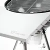 A close-up view of a stainless steel side table attached to a charcoal grill. Náhled obrázku produktu
