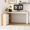 A corner of a room with a desk and storage unit. Voir les images du produit