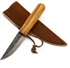 A knife and its leather sheath are placed on a white background. Produktbild-Vorschau