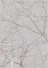 A close-up view of a rug with a pattern of tree branches. Náhled obrázku produktu