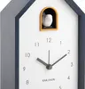 Close-up of a cuckoo clock with a bird emerging from its window. Anteprima dell’immagine prodotto