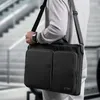 A person carrying a black laptop bag over their shoulder, with stairs in the background. Produktbild-Vorschau