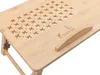 A close-up, angled view of a wooden laptop table with ventilation holes. Podgląd zdjęcia produktu