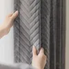 Hands adjusting a gray, quilted curtain. Náhled obrázku produktu