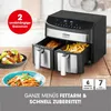 A Cuisine Edition dual-chamber air fryer is shown on a wooden table, with food in the chambers and on plates next to it. Promotional text and icons are overlaid. Produktbild-Vorschau