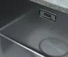 A close-up view of a stainless steel sink with a brand logo. Náhled obrázku produktu